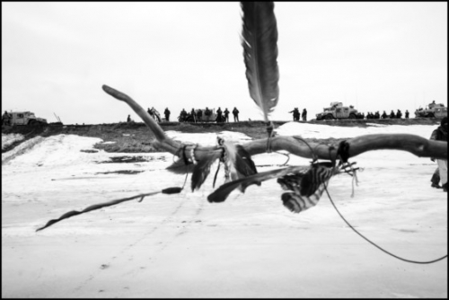 Larry Towell USA. North Dakota. February 23, 2017. Water Protectors protesters on the frozen Cannonball River. They had fled there after being forced out of their camp by the police..jpg