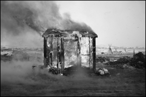 Larry Towell USA. Oceti Sakowin Camp, Standing Rock, North Dakota. Feburary 22nd, 2017. Ritual burning of structures. .jpg
