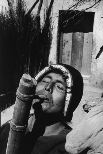 sergio larrainBOLIVIA. Tarabuco. Indian playing the Tocoro, typical instrument 1957.png