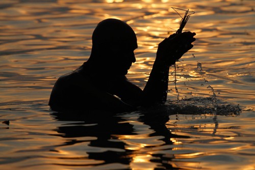 Rajesh Kumar Singh  A-Hindu-holy-man-performs-morning-prayers-after-taking-a-dip-in-the-River-Ganges-in-Allahabad-India-on-September-18-2011.jpg